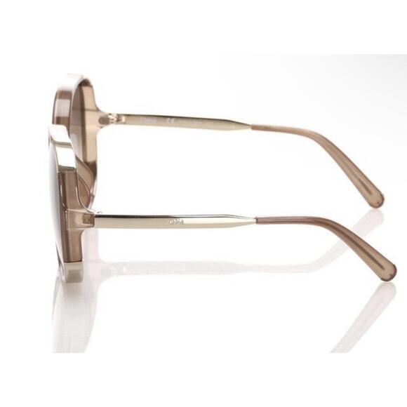 Chloé CE712S sunglasses feature a distinct brown and gold oversized round frame main image 5
